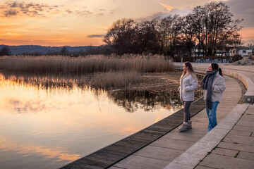 Walk along the promenade. A walk by the sea. Walking in nature. Sunset.