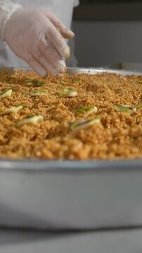 The pastry chef adds sesame to the pastry dough before grilling.