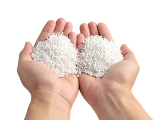 Two hands holding small white plastic pellets or granules, commonly used as raw material in manufacturing processes.