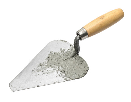 A masonry trowel with a wooden handle partially covered in wet cement.