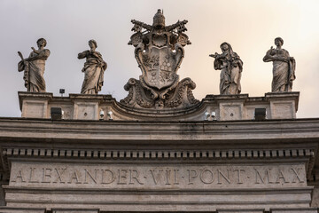 Obraz premium Monument to Pope Alexander VII, located in St. Peter's Basilica in Vatican City. Detailed photo of statue with inscription of of name of Alexander 7th Pont Max