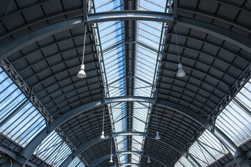 Roof of a large train station in a German city. View of the roof vault of a train station in...