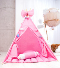 Playroom with Teepee. Modern room interior with play tent for child. pink children's wigwam in the...