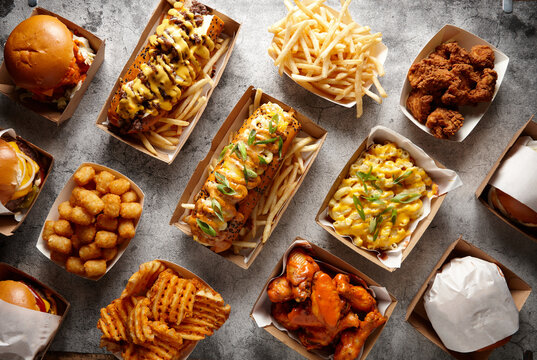 Overhead shot of different fried food dishes on a flat surface