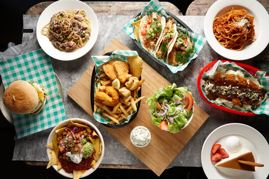 Overhead shots of different food dishes on a flat surface.