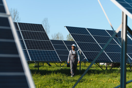 Skilled technician installing solar panels on a sunny day