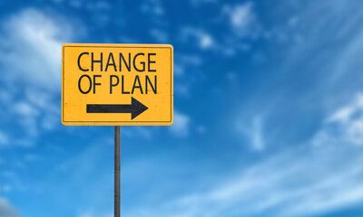 Change of planning sign symbol yellow orange color arrow direction black color font text change of plan blue sky background wallpaper copy space business success idea direction strategy goal future 