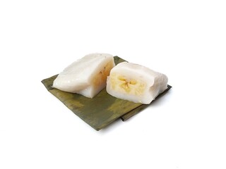 Papais or Nagasari cake. Indonesian food made from raw rice and glutinous rice wrapped in banana leaves. isolated on white background 