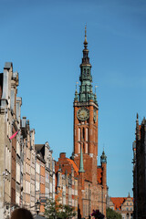 Obraz premium Gdansk Town Hall located on Dluga street (Long lane) in old town. A walk through the city on a sunny summer day. Gdansk, Poland