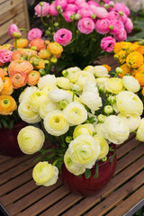 Vase with persian buttercup flower bouquet