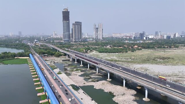 An Aerial Shot of Delhi Metro at Kalindi Kunj Bridge in Delhi, NCR, India
