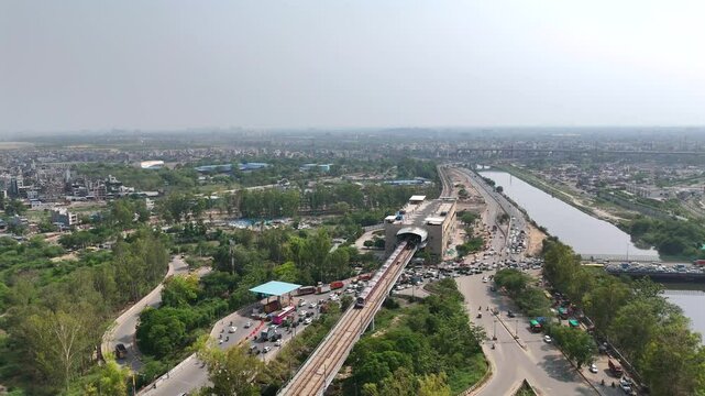 An Aerial Shot of Delhi Metro at Kalindi Kunj Bridge in Delhi, NCR, India
