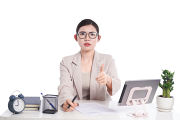 Asian businesswoman posing next to desk full of documents