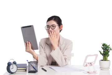 Asian businesswoman posing next to desk full of documents