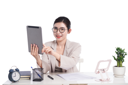 Asian businesswoman posing next to desk full of documents