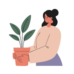 Young woman with dark hair in a calm mood holding a potted plant against a white background with copy space