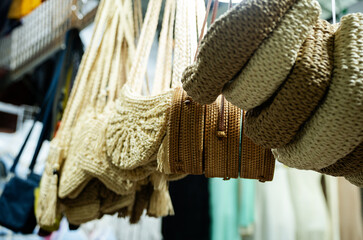 A bunch of handbags hanging on a rack