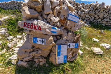 Panorama of the bay with the Vela Luka beach below, view of the beach from the top of the mountain, rocky beach
