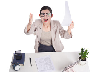 Asian businesswoman posing next to desk full of documents
