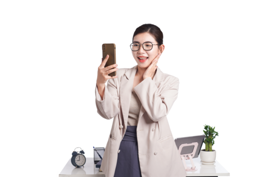 Asian businesswoman posing with smartphone, behind her is a table with lots of documents - Powered by Adobe