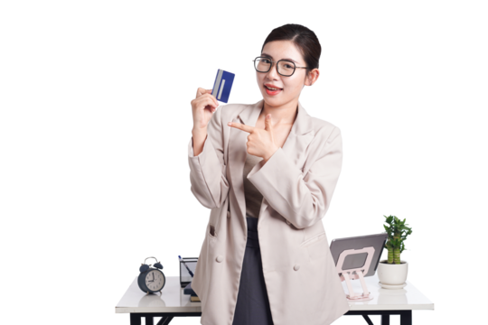 Asian businesswoman poses with bank card in hand, behind her is a table with lots of documents