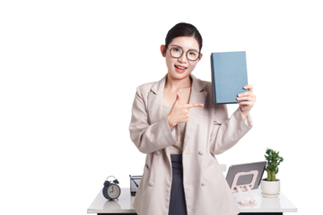 Asian businesswoman sitting at desk full of documents
