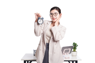 Asian businesswoman holding alarm clock and touching face, expressing surprise or realization about time