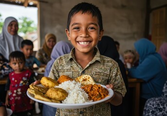 Smiling boy holds plate of food with family in background at mealtime