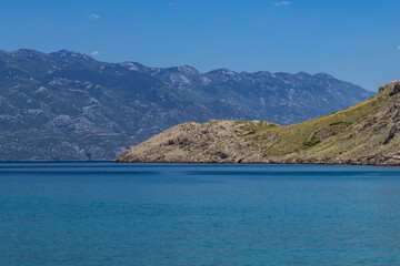 Obraz premium Panorama of the bay with the Vela Luka beach below, view of the beach from the top of the mountain, rocky beach