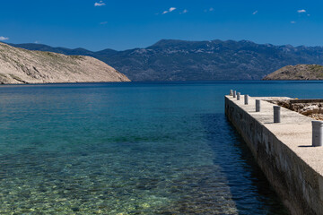 Fototapeta premium Panorama of the bay with the Vela Luka beach below, view of the beach from the top of the mountain, rocky beach