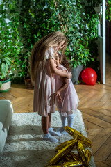 girls, Sisters joyfully embracing each other in a lush and cozy living space filled with warmth