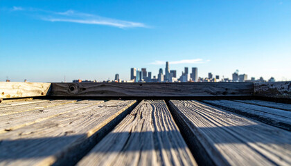 Naklejka premium City Skyline View from Wooden Pier with Clear Blue Sky Background