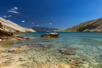 Fototapeta premium Panorama of the bay with the Vela Luka beach below, view of the beach from the top of the mountain, rocky beach