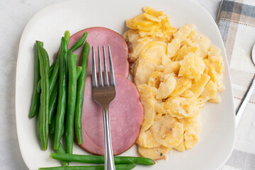 sliced ham with scallop potatoes,