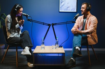 Show host interviewing woman during live stream, talking about fashion and style trends, disagreeing with her opinions. Man arguing with social media celebrity, recording podcast