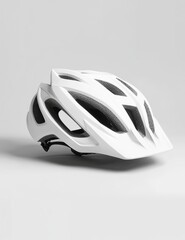 Fototapeta premium White mountain bike helmet. Protective headgear for off-road adventures. Modern design for cycling sports. Safety gear for trail, motocross, downhill. Helmet protects head from impact during fast