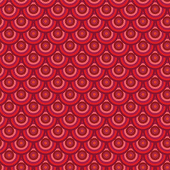 A vibrant, repeating pattern of concentric circles in shades of red and pink, resembling fish scales.