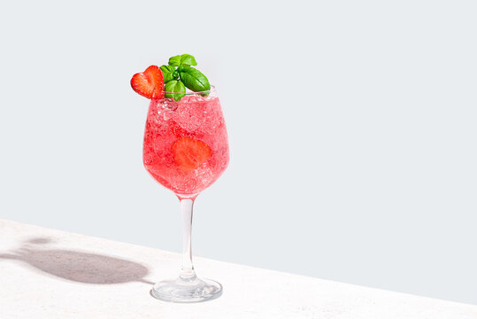 Glass of  strawberry and basil summer cocktail