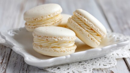 Fototapeta premium Delicious Vanilla Macarons on a Decorative White Plate
