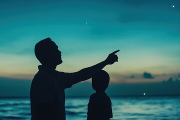 Father and Child Silhouette Pointing at Stars by the Ocean at Dusk