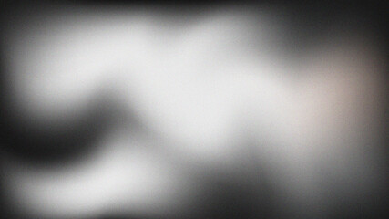 Abstract white light illuminating a black and gray textured gradient background