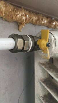 Fixing a leaking pipe connection at a home renovation site