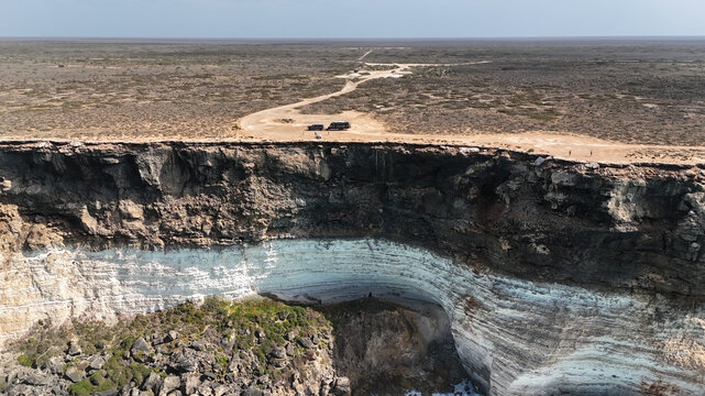 Aerial of caravan parked up at the edge of the Nullarbor cliffs