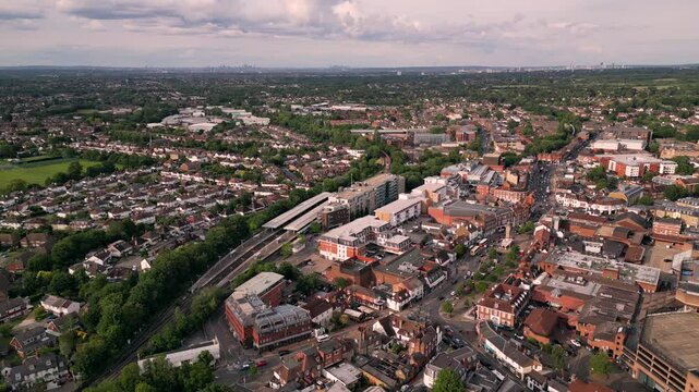 Drone aerial view of Epsom Town Centre with London Skyline background