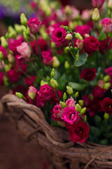 Closeup of a basket full of purple lisianthus flowers