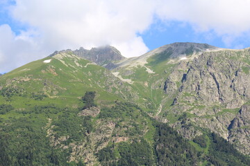 green grassy slopes of the caucasian mountains in dombai