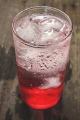 Red soda soft drink with ice