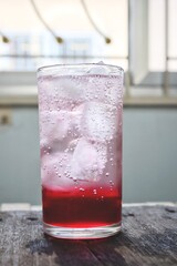 Red soda soft drink with ice