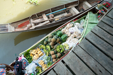 Traditional food and drink with local fruit sell on boat in floating market sightseeing travel
