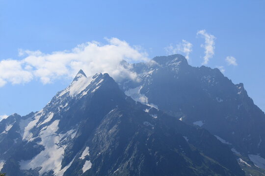 mountain peaks in the clouds Dombay midsummer